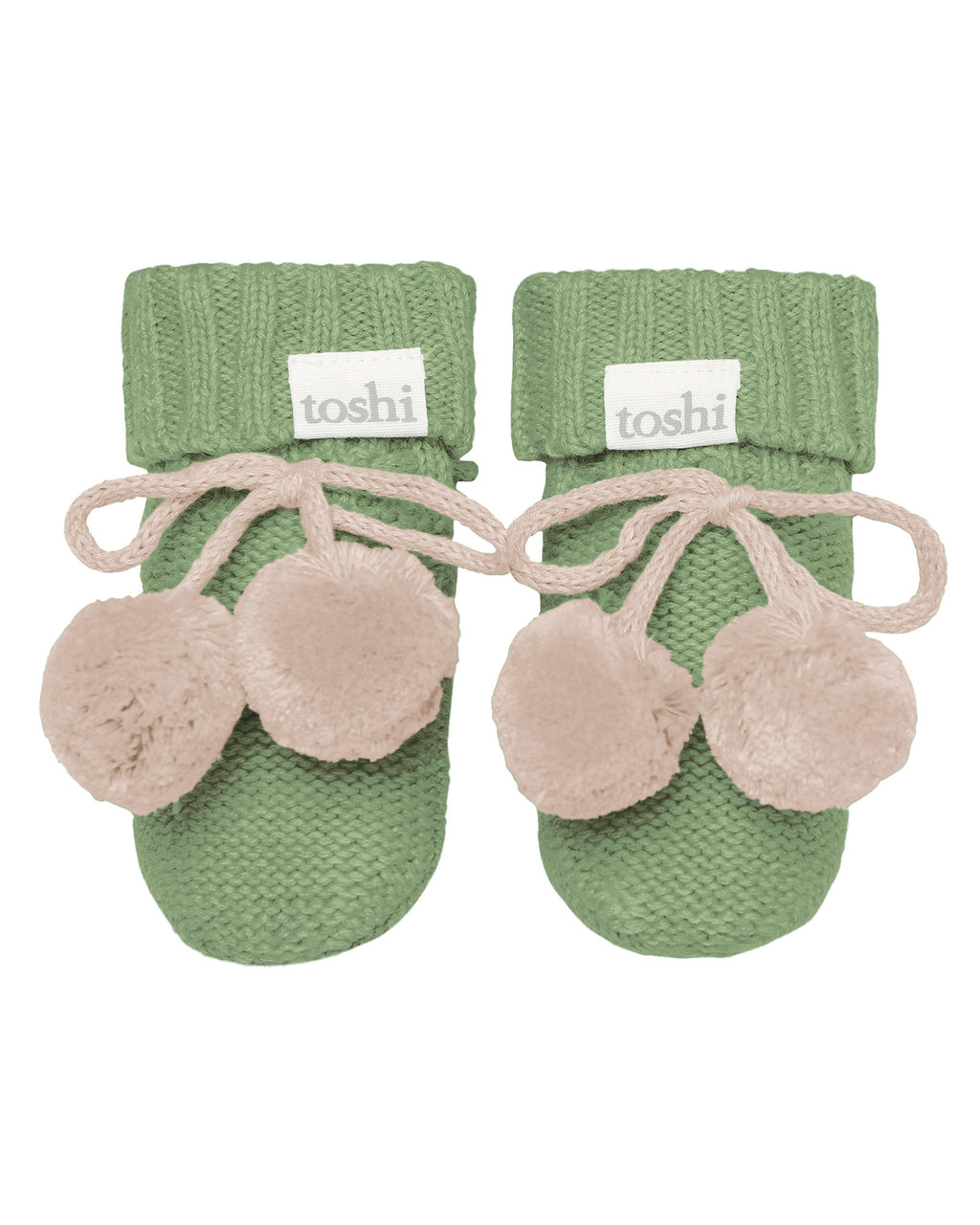 Pair of green baby booties with beige pom-poms on a white background, featuring the brand 'toshi'.