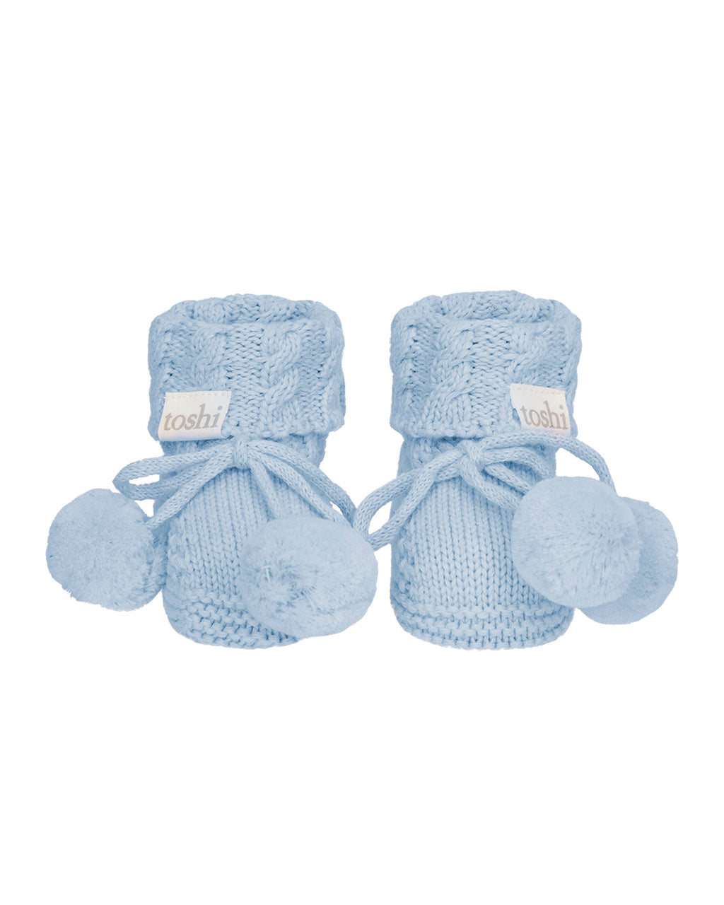 Pair of bluebell, a blue baby booties with pom-poms on a white background.