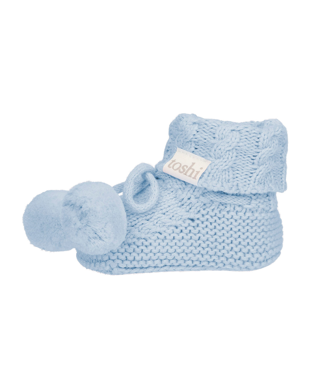 Bluebell, a light blue organic baby booties with pom-pom on a white background.