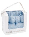 Pack of bluebell, a blue organic baby booties in a Toshi branded box on a white background.