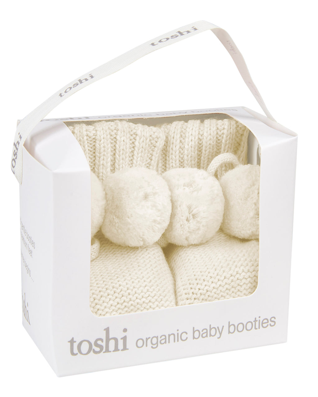 Toshi Cream organic baby booties in a white box on a white background.