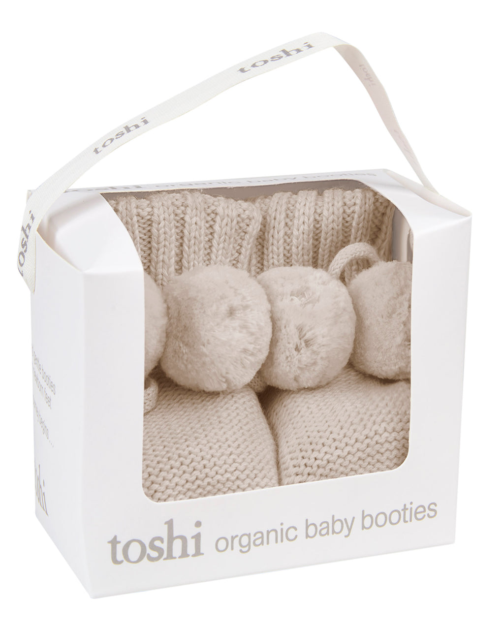 Oatmeal, a Toshi organic beige baby booties on a packaging with a white background.