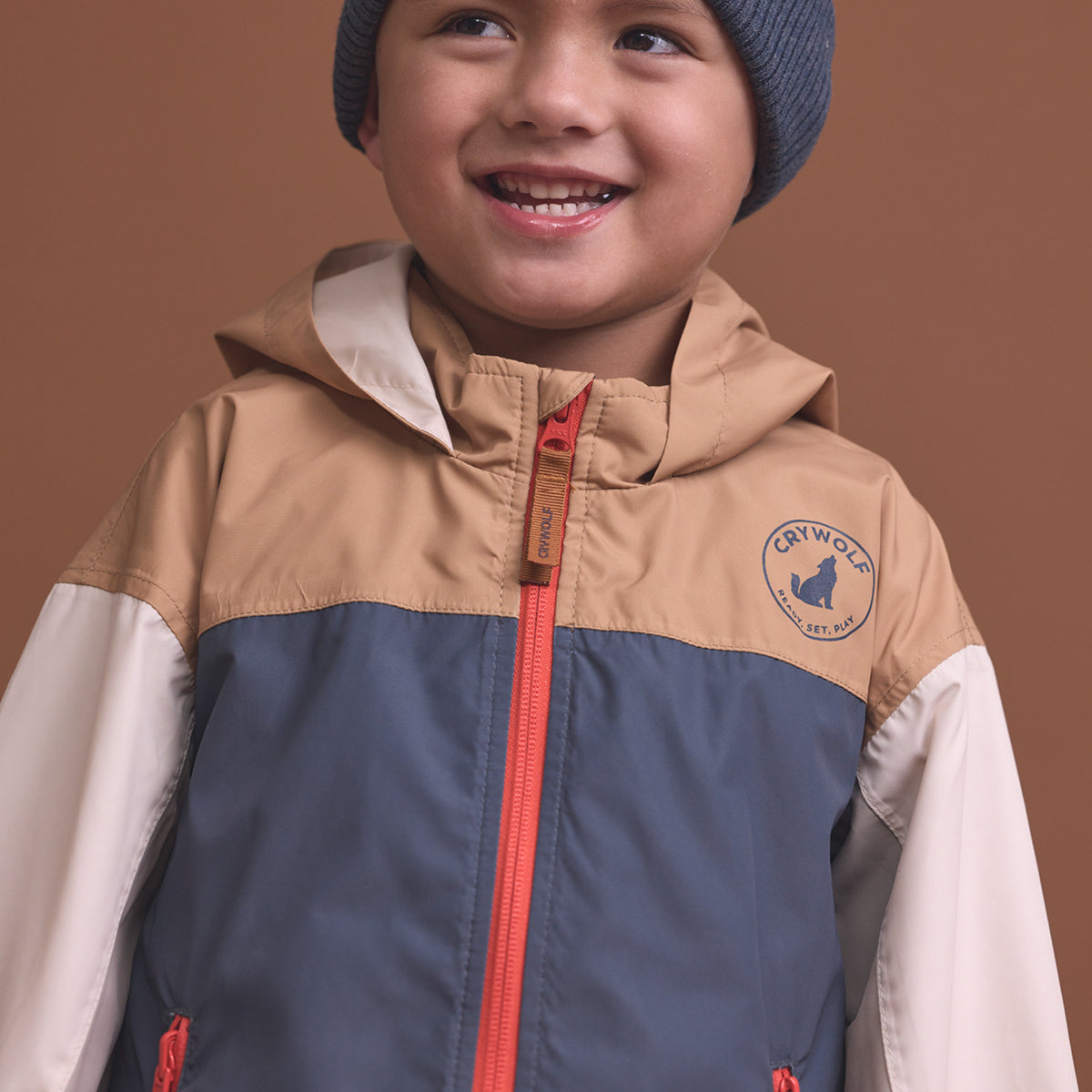 Child wearing the Crywolf Packable Jacket Ash Colourblock.
