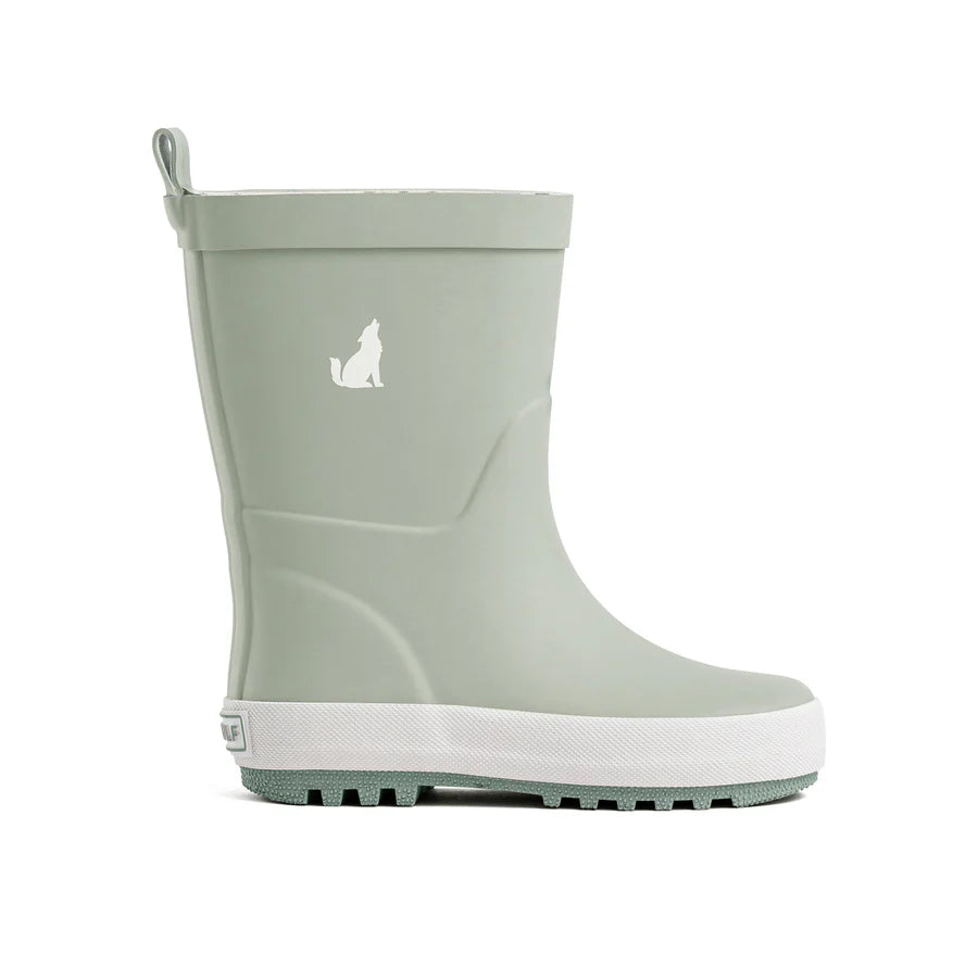 A sage green rubber rain boot with a white sole and a white dog silhouette logo on the side, shown against a plain white background.
