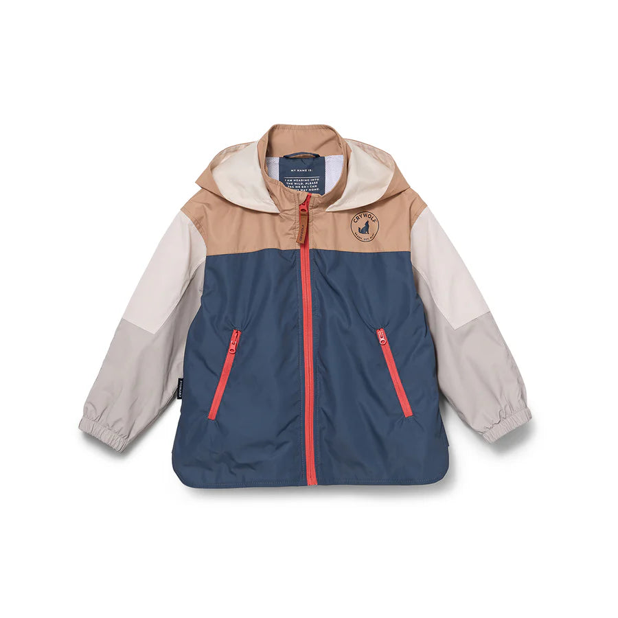 Front view of a color-blocked kids' jacket featuring a tan upper chest and hood, light gray sleeves, a deep navy blue lower body, and a bright orange-red front zipper and pocket accents.