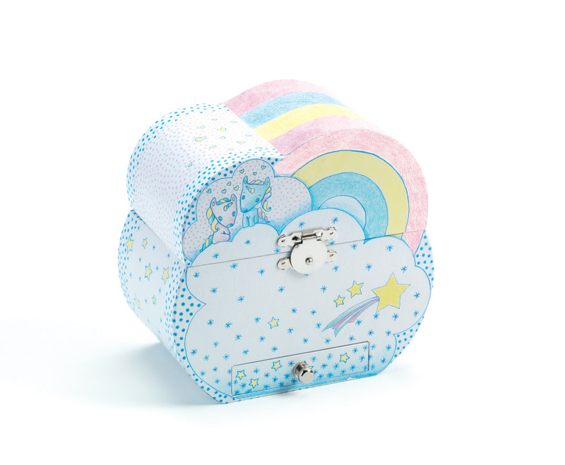 Djeco Unicorn Dream Music Box, an Open pastel blue children's music box decorated with yellow stars and white dots, featuring a yellow-lined interior, cloud-shaped vanity mirror, and a white unicorn figurine with a pink and blue mane.
