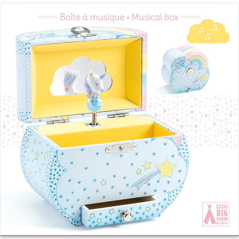 Open pastel blue children's music box decorated with yellow stars and white dots, featuring a yellow-lined interior, cloud-shaped vanity mirror, and a white unicorn figurine with a pink and blue mane.