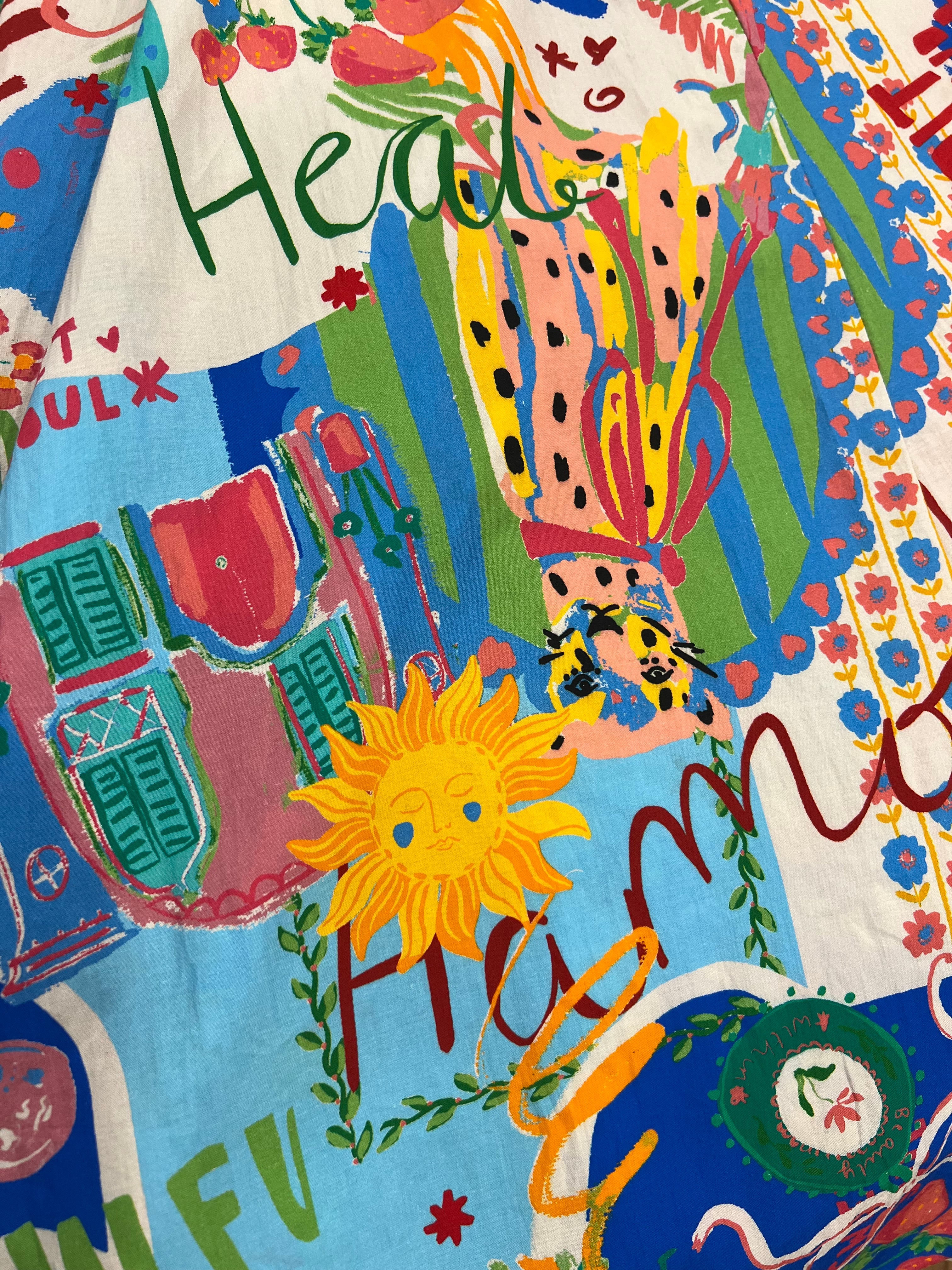 A close-up of a colorful printed fabric of Sweet SoulPrint.
