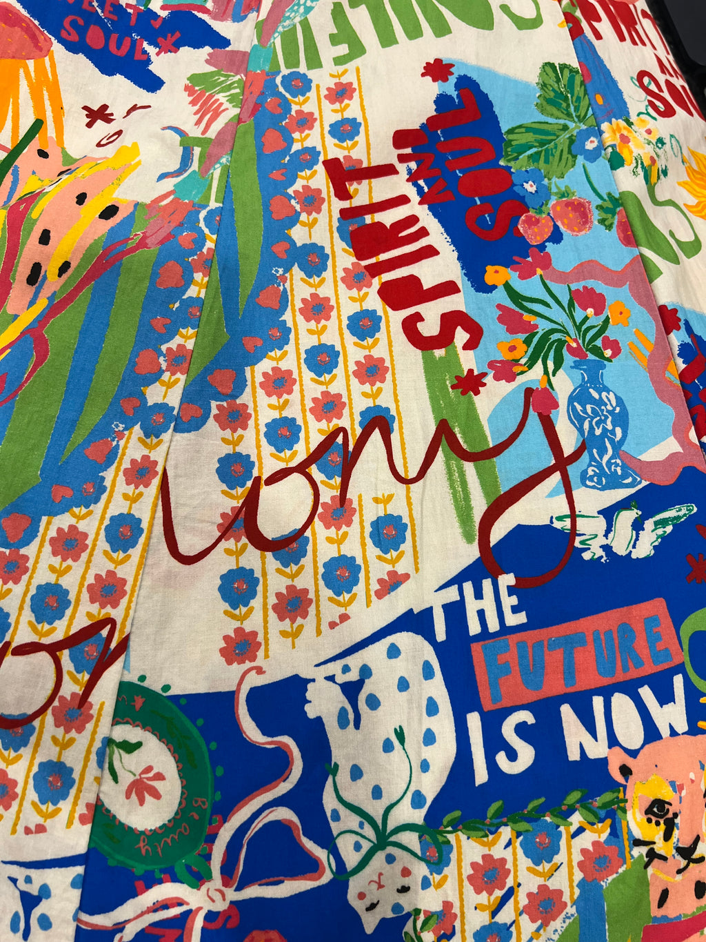 A close-up of a colorful printed fabric of Sweet SoulPrint.