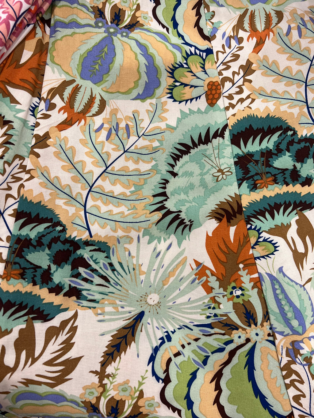 A close-up of the MilaMeli Byron Pant Agave Greens fabric.