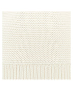 Close up of Toshi Organic Beanie Snowy/Cream, cream white knit beanie with pom-poms on a white background.