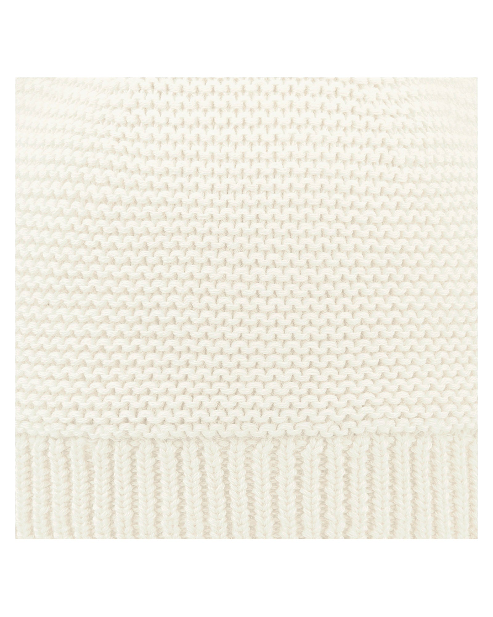 Close up of Toshi Organic Beanie Snowy/Cream, cream white knit beanie with pom-poms on a white background.