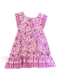 Floral print kids' ruffled mini dress with tassel ties in Lilac haze print, a vibrant shades of magenta, pink, and cream.