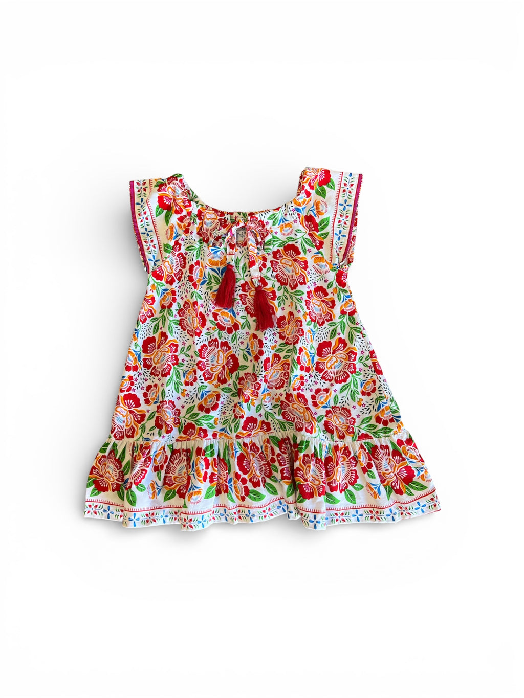 Floral dress featuring Fiesta Bloom print, a white base with a vibrant floral pattern in red, orange, green, and blue.
