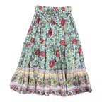 A tiered bohemian-style maxi skirt with a light blue base, red and pink floral print, and a decorative ruffled border at the hem, Maeve Maxi Skirt Aqua Wildflower in white background.