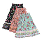 Three bohemian floral maxi skirts in different colors and patterns, displayed overlapping on a plain white background.