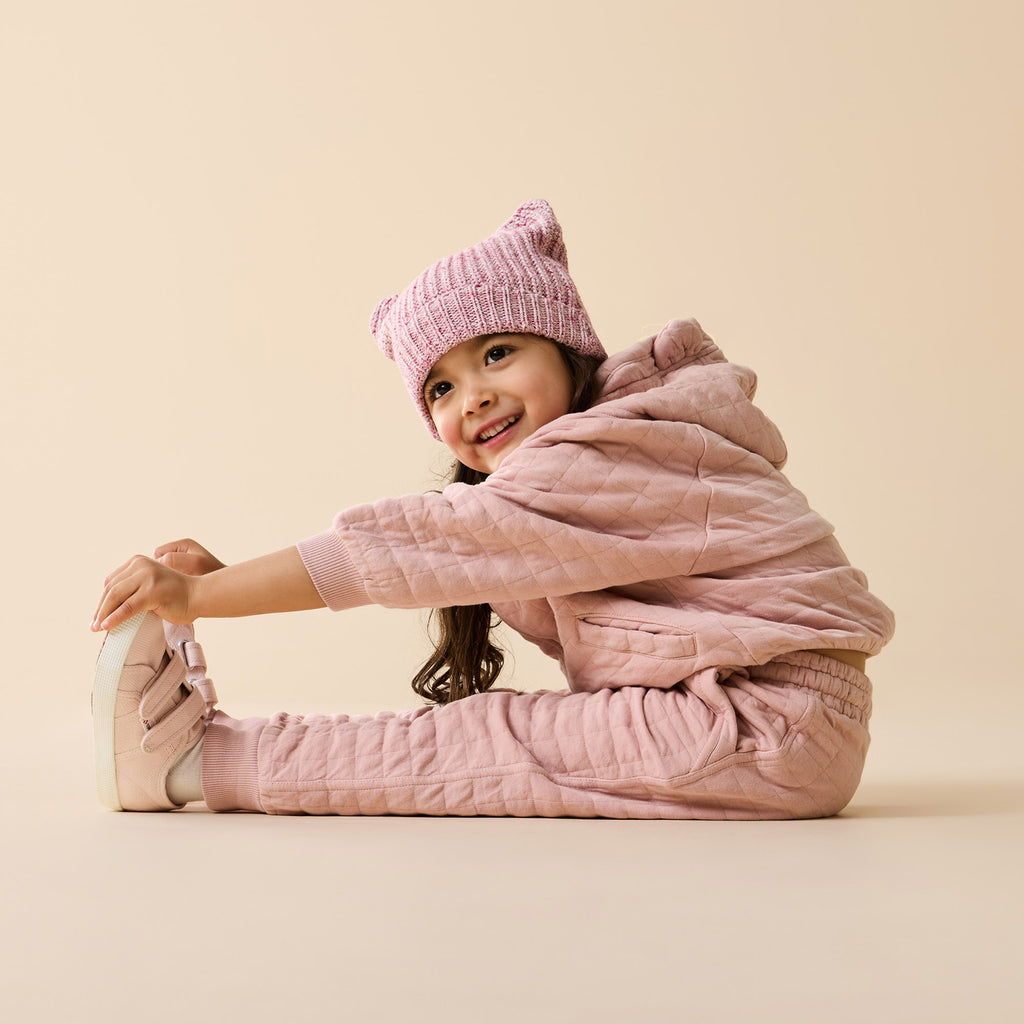 Child wearing a Wilson & Frenchy Rose Organic Quilted Jacket.