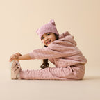 Child wearing a Wilson & Frenchy Rose Organic Quilted Jacket.