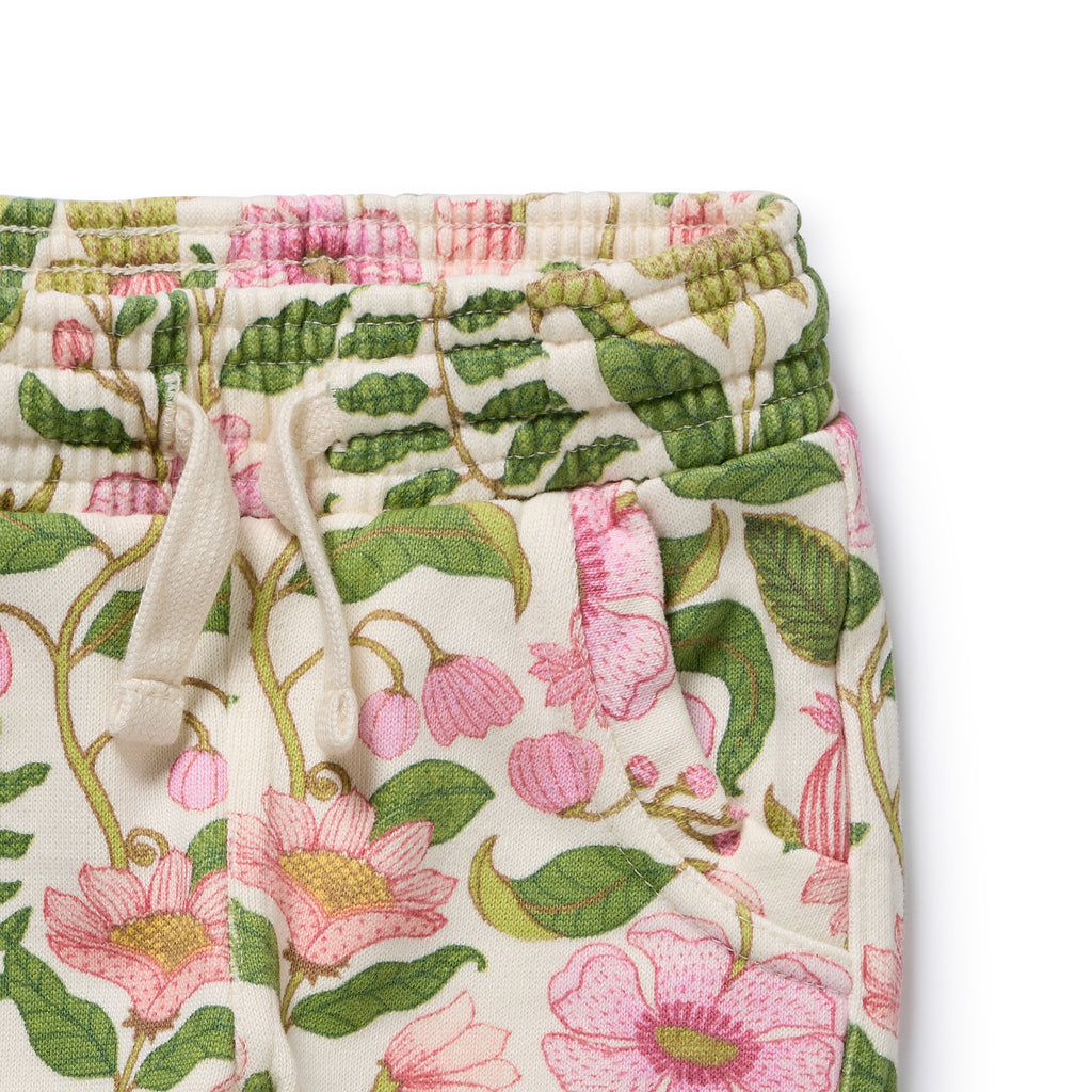 Floral patterned pants with a white drawstring on a white background