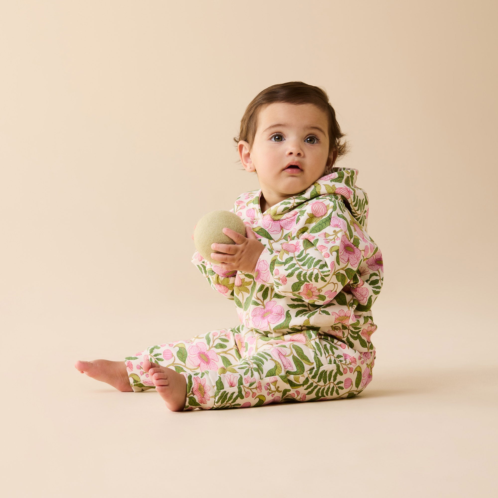 Baby in a floral wearing Wilson & Frenchy Organic Cotton Sweat Pants.
