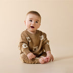 Baby wearing a Wilson & Frenchy Organic Knitted Jumper and 
Wilson & Frenchy Organic Knitted Jumper.