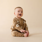 Baby wearing a Wilson & Frenchy Organic Knitted Jumper and 
Wilson & Frenchy Organic Knitted Jumper.