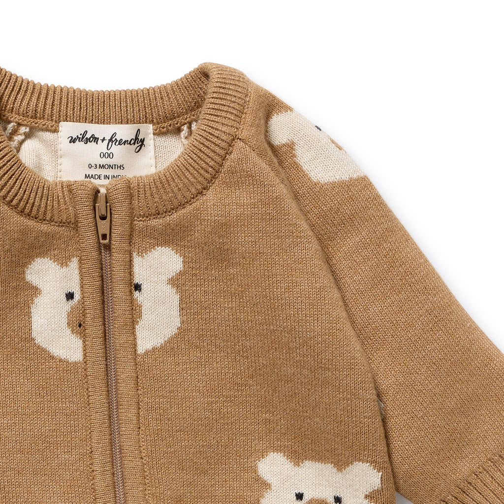 Wilson & Frenchy Organic Knitted Jacquard Growsuit, a brown onesie with bear patterns.