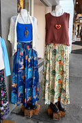 Two mannequins display MilaMeli Byron Pant Agave Greens.